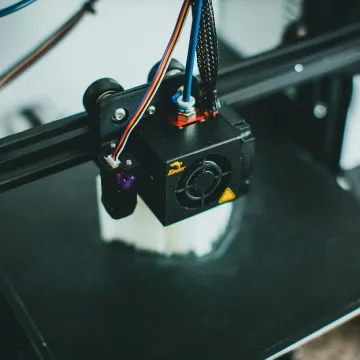 Detailed shot of a 3D printer creating an object, 