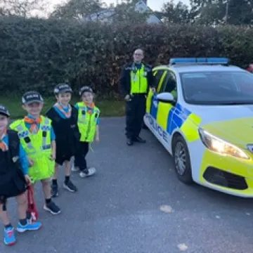 Beavers outside police car Oct 2023 Photo 2023 10 09 20 28 50