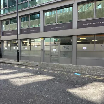 Street view of spray painting and glazing at Abbey College Manchester.