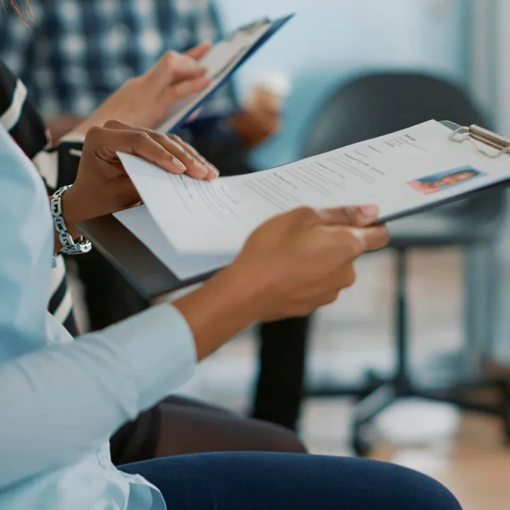 Female candidate sitting in queue and receiving cv files, wa