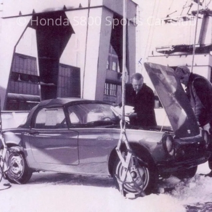 Car ready for hoisting onto the waiting ship