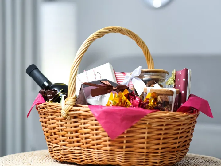 A wicker welcome hamper filled with local produce, wine and preserves