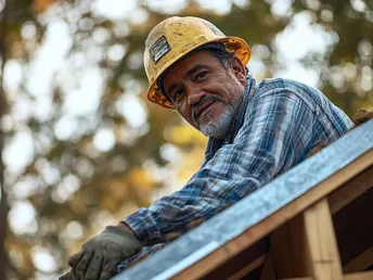 a man wearing a hard hat is looking down on a roof
