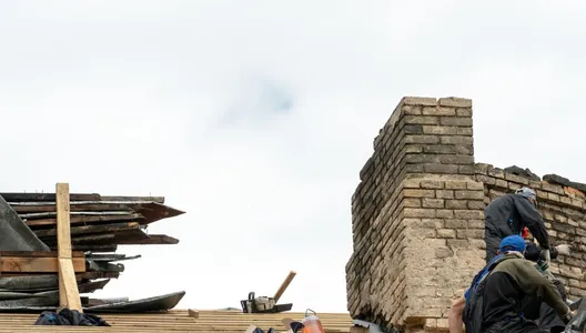 Repair of a wooden roof and an old brick chimney pipe Worker