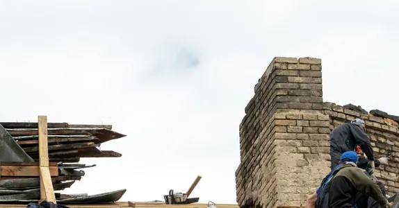 Repair of a wooden roof and an old brick chimney pipe Worker