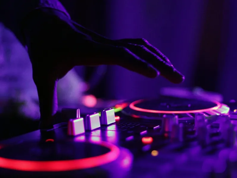 Hand on the mixer under violet light