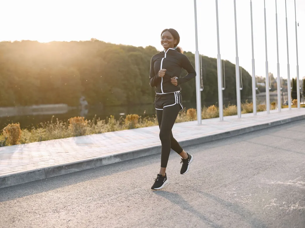 Runner training outdoors in morning light