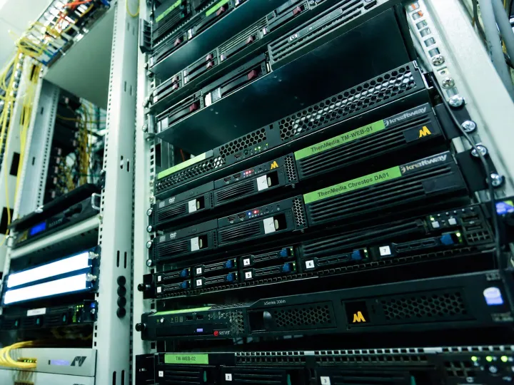 Servers in a rack, labelled ThenMedia and Chrestos