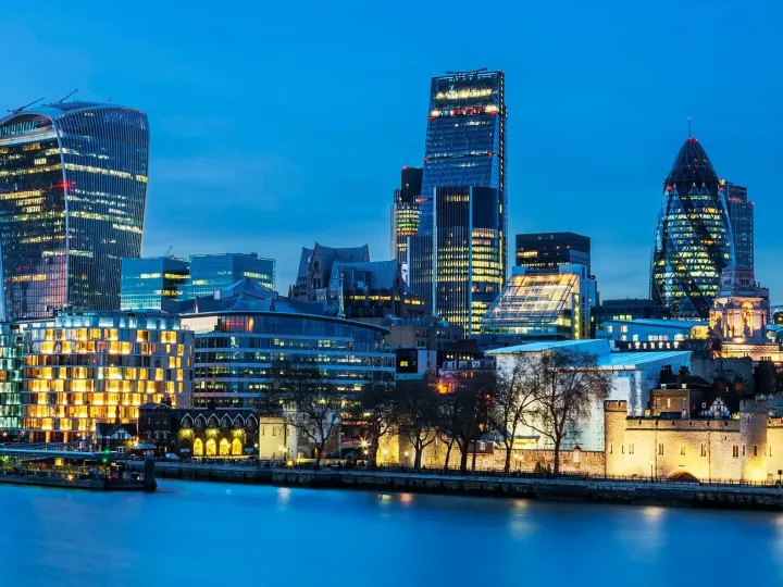 The London skyline at dusk, seen across the River Thames