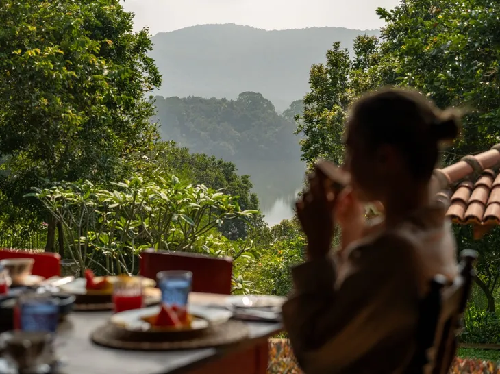 Breakfast taken slowly on the veranda above the garden at Peacock Hill Sigiriya
