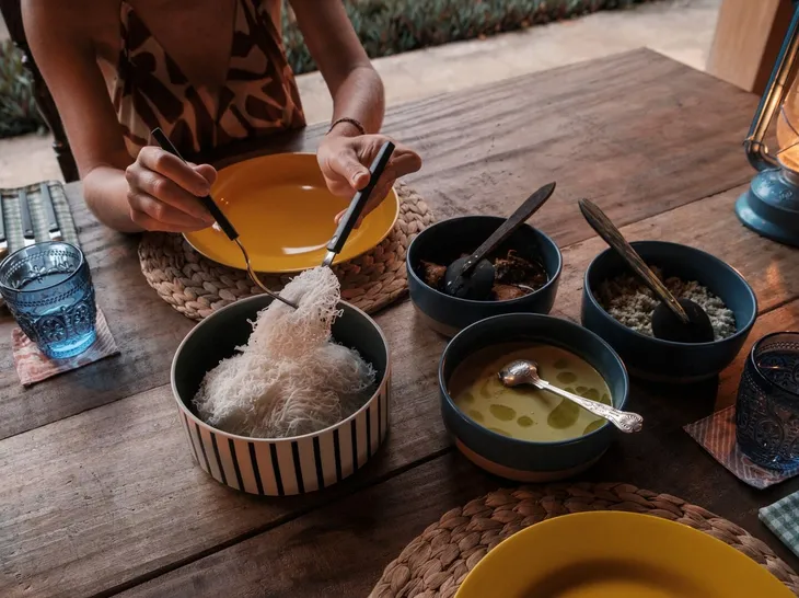 A traditional Sri Lankan rice and curry lunch served in clay bowls at Peacock Hill Sigiriya