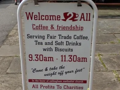 Welcome 2 all Cafe street sign