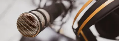 Headphones resting on a microphone