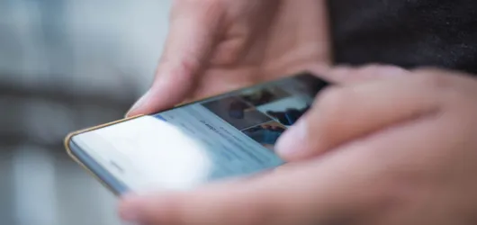Person Using Smartphone Shallow Focus Photography