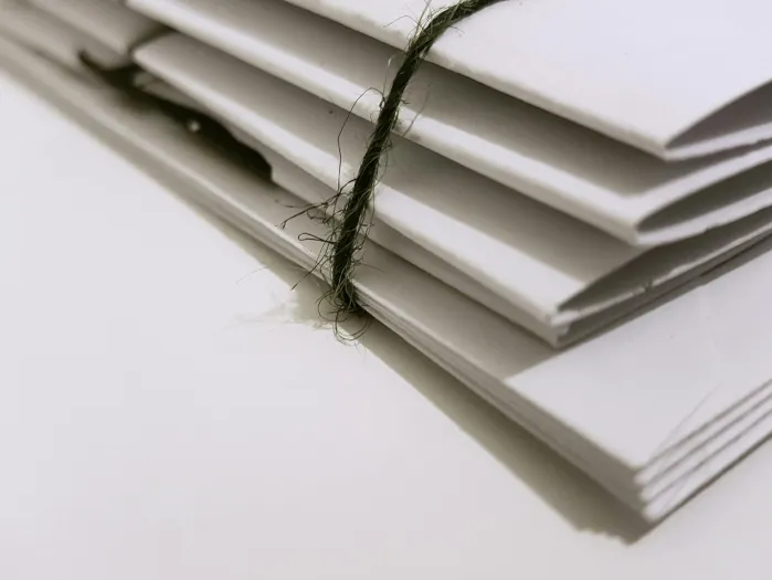 White Paper Folders With Black Tie