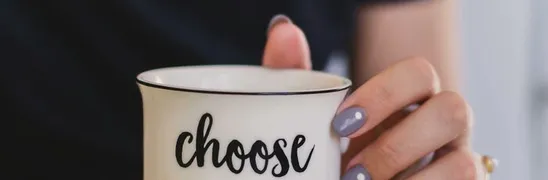 Selective Focus Photography of Person Touch the White Ceramic Mug With Choose Happy Graphic