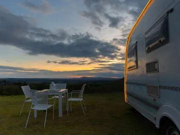 Campsite with caravans at dusk time