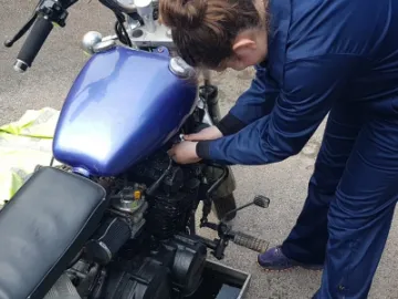 Maddie Working On Mechanics Badge