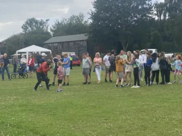 Summer fete 2023 Francis leading the fun and games