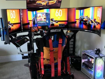 Racing sim rig with a multiple screen layout