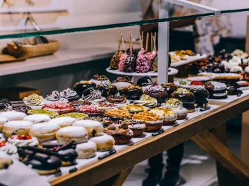 A tempting display of various donuts and pastries 