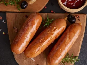 sausages and ingredients for cooking. Grilled