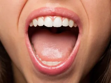 Close-up of girl opening her mouth