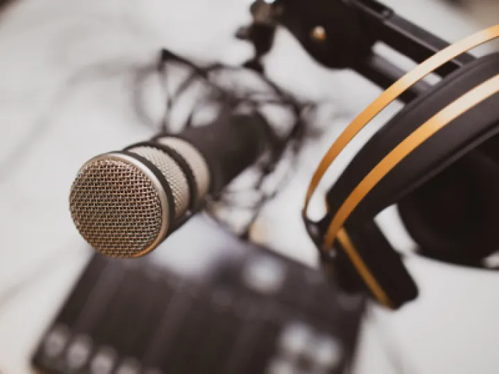 Headphones resting on a microphone
