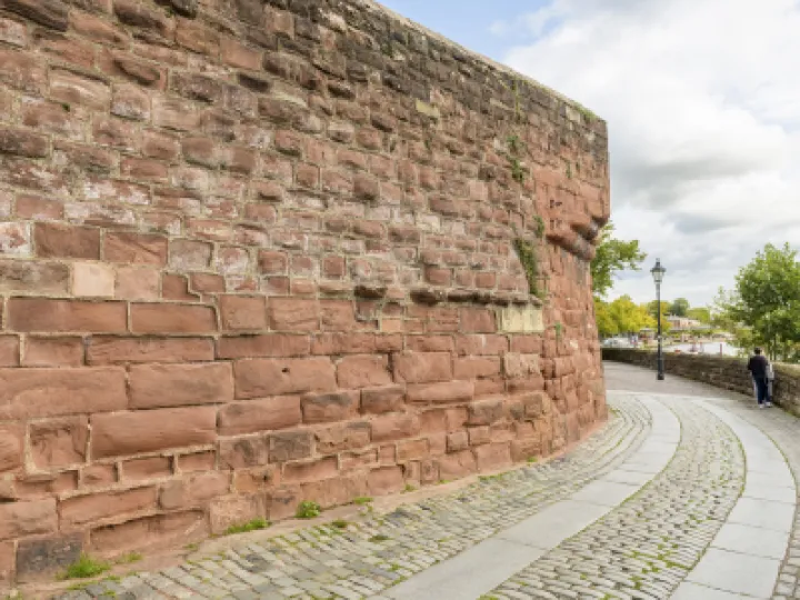 Chester City walls &ndash; hard cement mortar standing proud between eroded sandstone