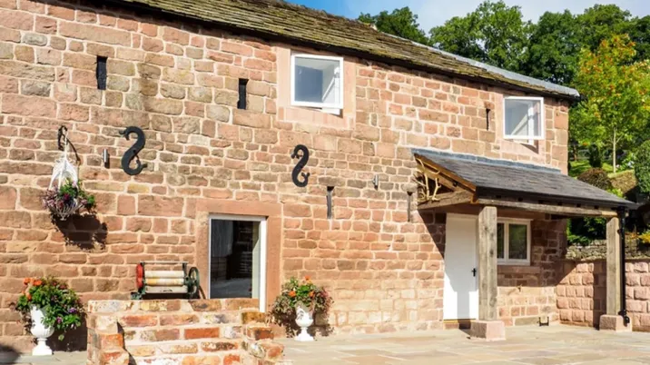 Otters Retreat holiday cottage, the front door and porch on the farm courtyard